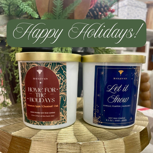 two holiday soy candles. apple, chesnut, oak and praline candle. the other is a vanilla, pumpkin and hazelnut scent