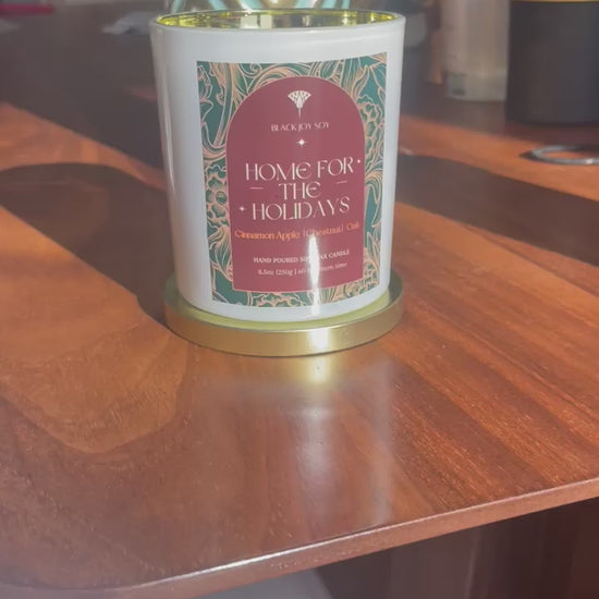 video of decorative holiday candle. Apple chestnut, oak and praline scented candle.